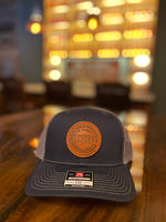 Load image into Gallery viewer, Trucker Hat with Leather Patch
